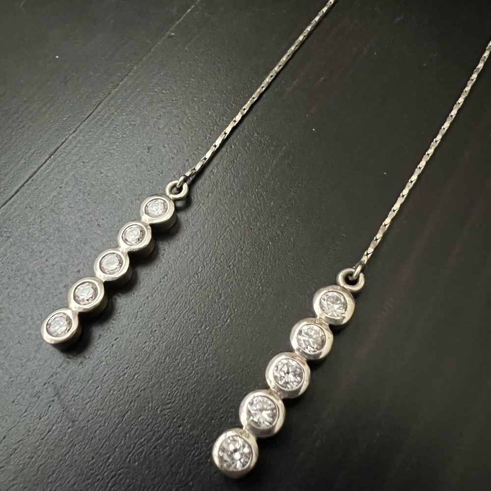 925 sterling silver and cubic zirconia dangle earrings.